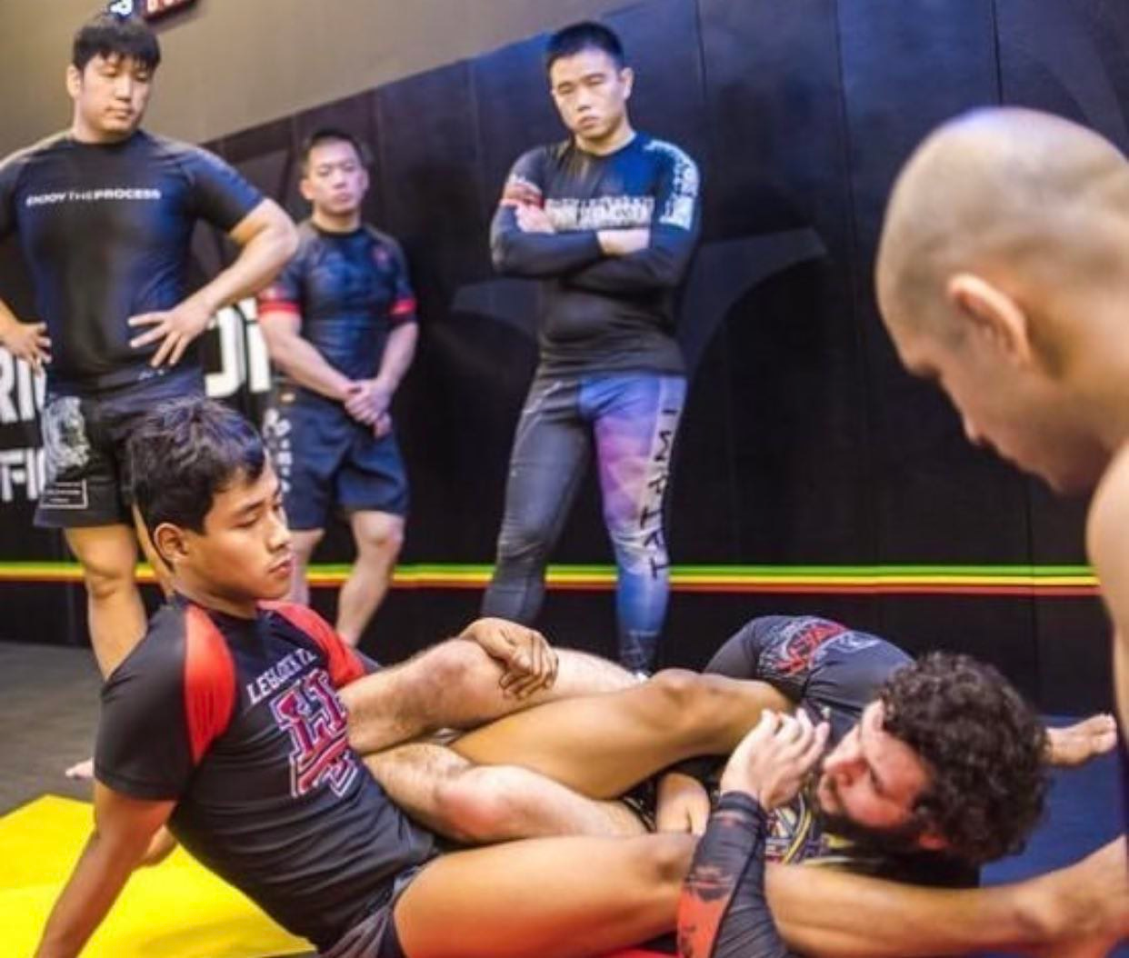 Derek grappling on the mats